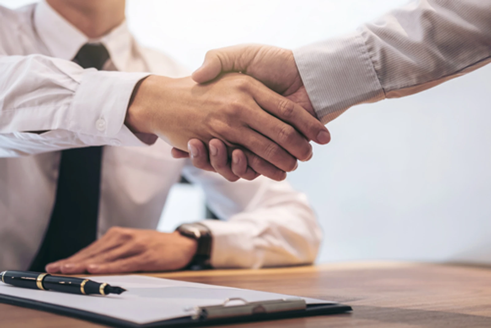 Business Partnership - Two people shaking hands